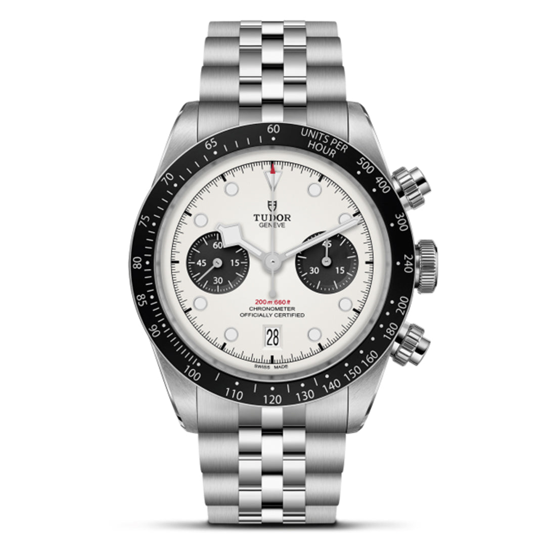 The TUDOR Black Bay Chrono features a stainless steel bracelet, T-Fit clasp, white dial, black bezel with tachymeter scale, three sub-dials, two chronograph pushers, and a date window at 6 o'clock.