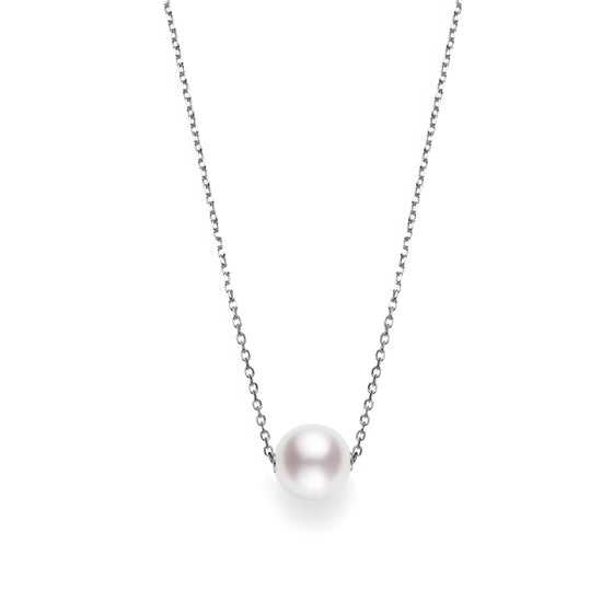 The Mikimoto 18k White Gold Akoya Cultured Pearl Pendant showcases a single Akoya cultured pearl elegantly suspended on a slender 18k white gold chain, set against a simple white background. The pearl takes center stage, offering an elegant and refined appearance.