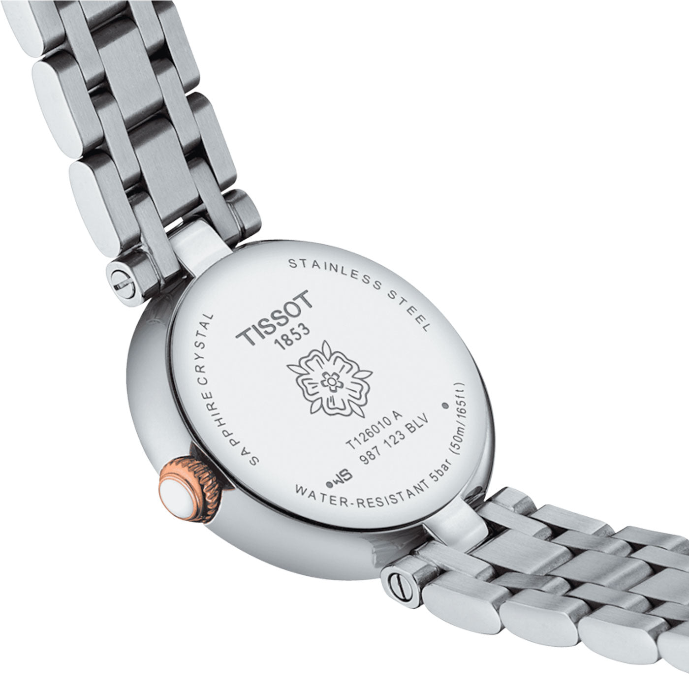 Close-up of the stainless steel back of the Tissot Bellissima Small Lady Quartz 26mm watch, featuring "Tissot 1853," a decorative emblem, model number T128009A, and information about water resistance. The watch includes a metal link bracelet, copper-colored crown, Swiss Quartz movement, and scratch-resistant sapphire crystal.