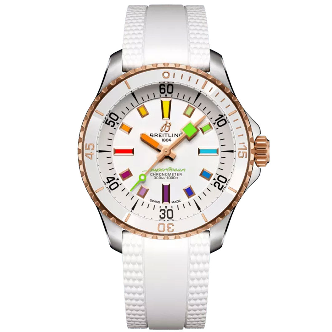 The BREITLING Superocean Automatic 36 features a white dial adorned with vibrant, luminescent indexes and a bezel in silver and rose gold tones. Its white textured strap beautifully matches the silver minute markings and hands. The "Superocean" label is proudly displayed on its dial, making it a fashionable dive watch from Breitling.