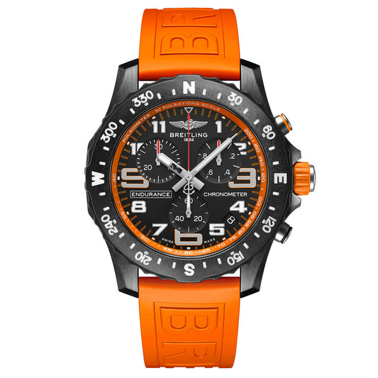The BREITLING Endurance Pro 44 sports watch by Breitling features a black dial with white numerals, bold orange accents, multiple subdials, an orange rubber strap, and a Breitlight bezel with pulsometer scale.