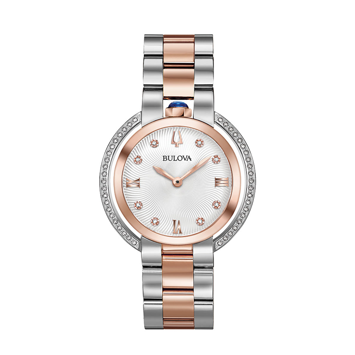 The Bulova Rubaiyat Quartz 35mm Watch features a stainless steel bracelet enhanced with elegant rose gold-tone accents. It has a round silver-toned dial with rose gold hour markers, while the bezel is beautifully decorated with small crystals, and the crown displays a distinctive blue accent.