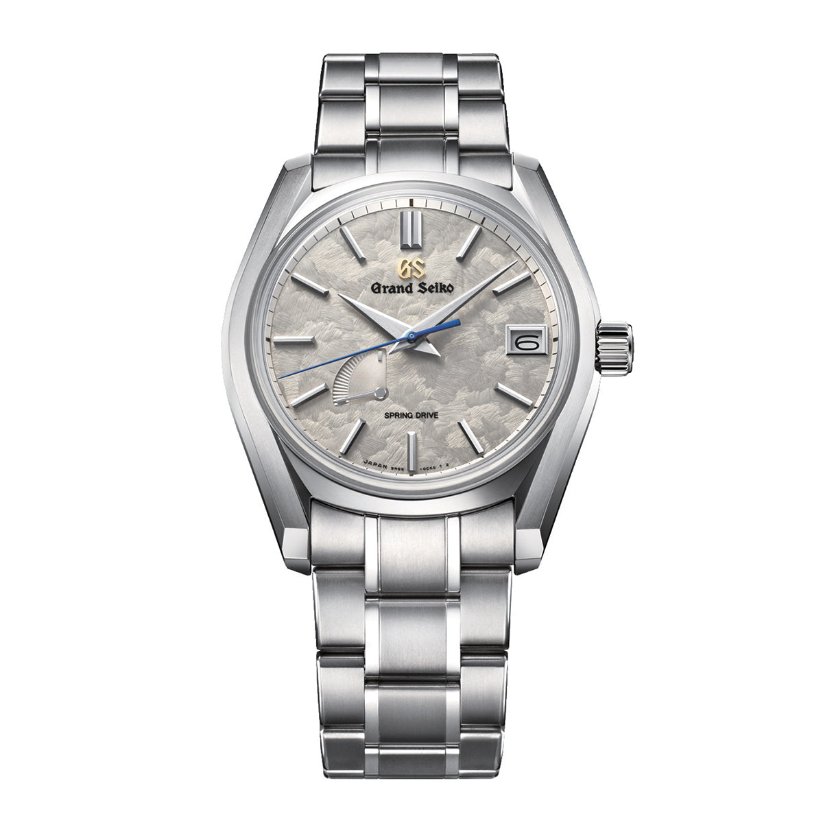 The Grand Seiko Heritage Collection 62GS TAISETSU Spring Drive 40mm Watch, a silver timepiece from the acclaimed Grand Seiko brand, boasts a textured white and gray dial with sleek silver hour markers and hands. A date window elegantly resides at the 3 o'clock position, while a sturdy metal bracelet and polished titanium case enhance its sophisticated design and durability.