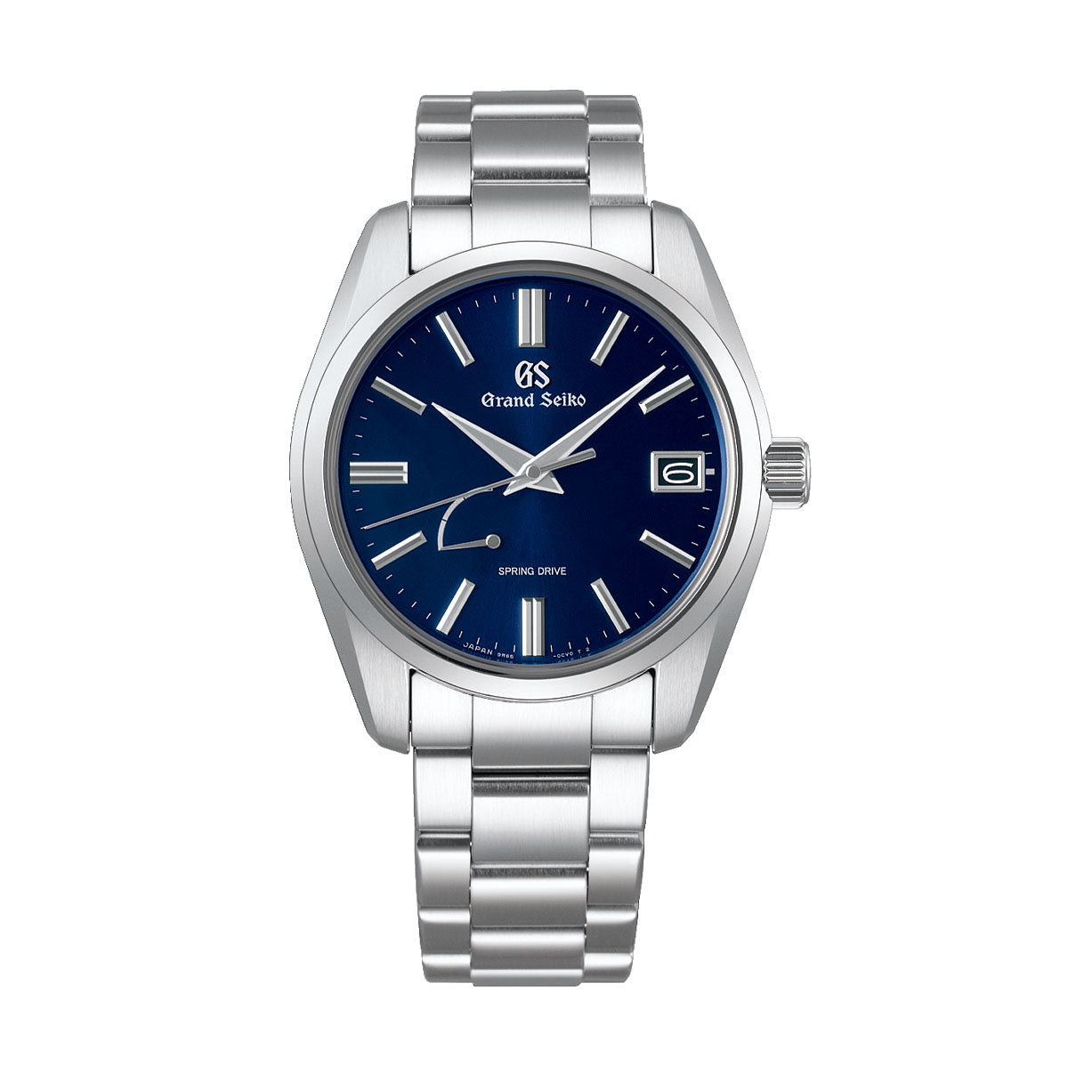 A Grand Seiko Heritage Collection Spring Drive 40mm Watch featuring a stainless steel bracelet and a midnight blue dial. The watch includes silver hour markers and hands, a date window at the 3 o'clock position, along with the "Grand Seiko" and "Spring Drive" inscriptions on the dial.