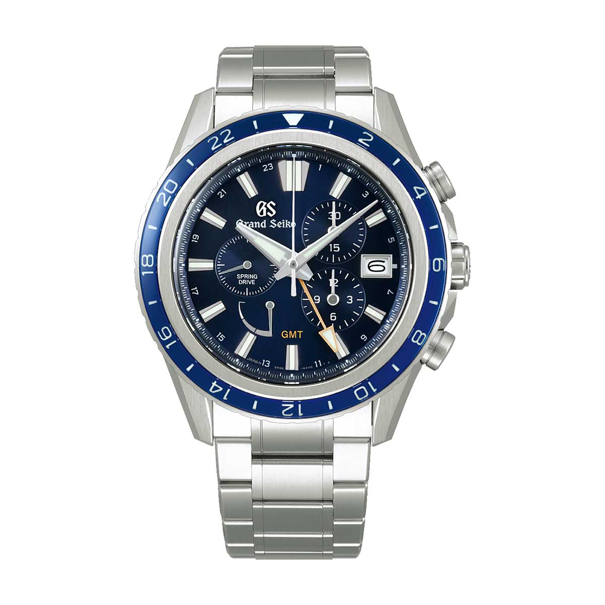 This Grand Seiko Evolution 9 Collection Spring Drive Chronograph GMT 45.3mm Watch, a special 15th Anniversary Limited Edition of 700 pieces, features a stainless steel design with an eye-catching blue and black face. It is equipped with three sub-dials, a GMT hand, and a date window at the 3 o'clock position. The watch also includes a blue bezel with a 24-hour scale, beautifully paired with the silver metal bracelet.