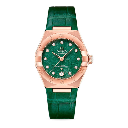 The OMEGA Constellation Co-Axial Master Chronometer 29mm Watch features a luxurious Sedna™ gold case paired with a striking green marble dial. It showcases diamond hour markers, complemented by a green leather strap. The bezel is adorned with Roman numerals, and there's a date window positioned at six o'clock. Powered by the Co-Axial Master Chronometer Calibre 8701, this timepiece offers exceptional precision.
