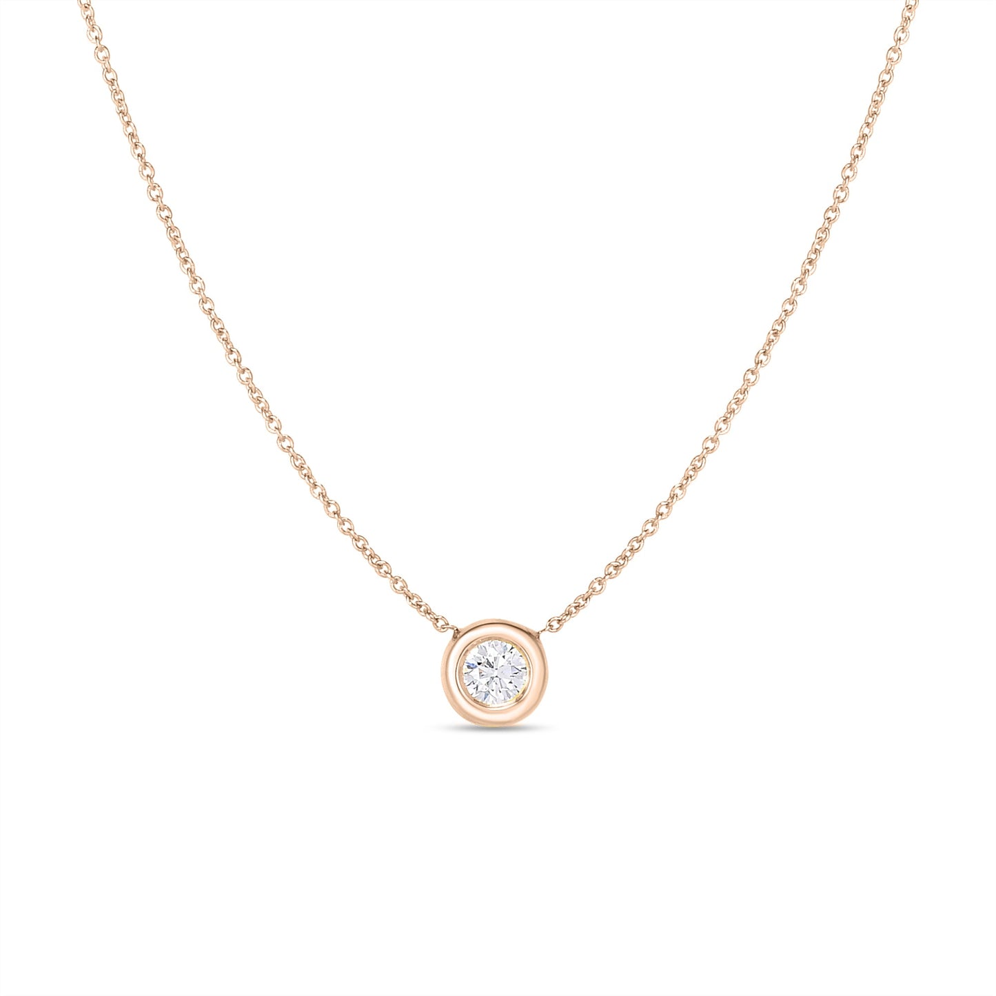 The Roberto Coin 18K Rose Gold Tiny Treasures Single Diamond Bezel Pendant Necklace showcases a single round diamond pendant elegantly set in a bezel. Its fine chain and minimalist design emphasize the sophistication of this piece, making it an ideal choice for both everyday wear and special occasions.