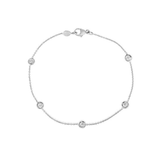 Introducing the Roberto Coin Diamonds By The Inch bracelet: an elegant piece crafted in 18K white gold, featuring a thin chain embellished with five evenly spaced small round gemstones and finished with a lobster clasp closure, showcasing the timeless elegance synonymous with Roberto Coin designs.