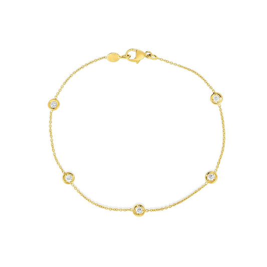 The Roberto Coin Diamonds By The Inch 18K Yellow Gold 5 Station Bracelet features five bezel-set round white gemstones evenly spaced on a delicate gold chain, finished with a lobster clasp closure.