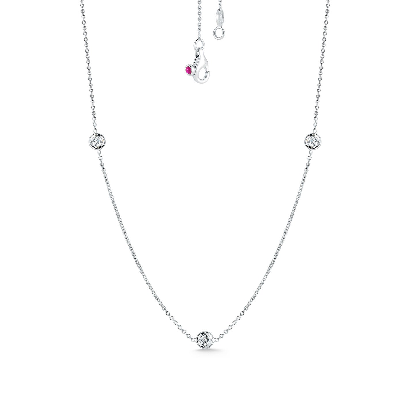 The Roberto Coin Diamonds By The Inch 18K White Gold Three Station Necklace is a delicate piece that features three round diamond accents evenly spaced along its thin chain and secured with a lobster clasp, exemplifying the elegance typical of Roberto Coin's designs.