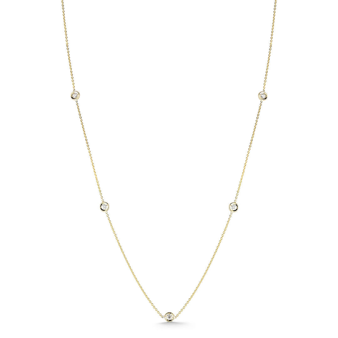 The Roberto Coin Diamonds By The Inch 18K Yellow Gold 7 Station Necklace features seven small round diamonds set along a fine gold chain, offering subtle elegance.