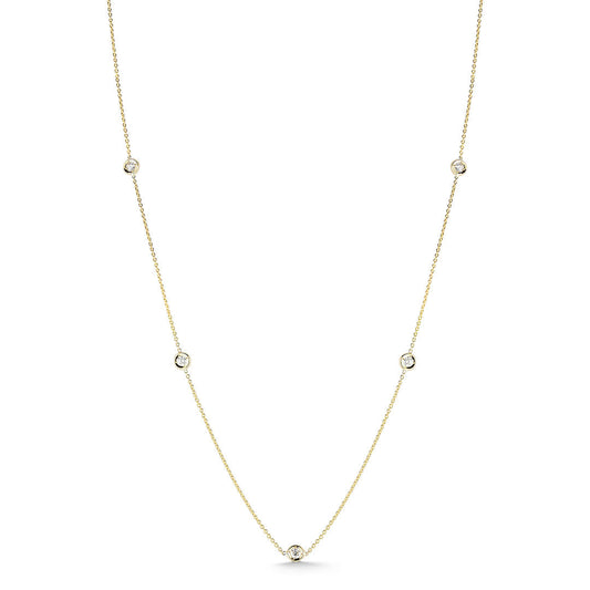The Roberto Coin Diamonds By The Inch 18K Yellow Gold 7 Station Necklace features seven small round diamonds set along a fine gold chain, offering subtle elegance.