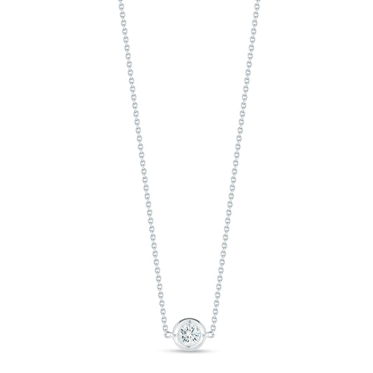 The Roberto Coin Diamonds By The Inch 18k White Gold Necklace Pendant showcases a graceful design with a single round diamond elegantly set in a circular setting. Its fine and symmetrical chain enhances the simple yet sophisticated aesthetic, echoing the timeless elegance typical of the Roberto Coin brand.