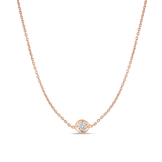 The Roberto Coin Diamonds By The Inch 18k Rose Gold Necklace Pendant, crafted by Roberto Coin, showcases a delicate design featuring a simple and elegant chain that beautifully accentuates a small round diamond centerpiece, creating a stunning station effect.
