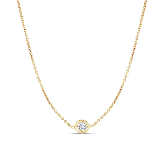 Introducing the Roberto Coin Diamonds By The Inch 18k Yellow Gold Necklace Pendant, a refined piece from the renowned brand Roberto Coin. This elegant necklace showcases a solitaire diamond pendant encased in a sophisticated gold bezel setting. The circular diamond is perfectly accentuated against a simple white backdrop, highlighting its exquisite beauty.