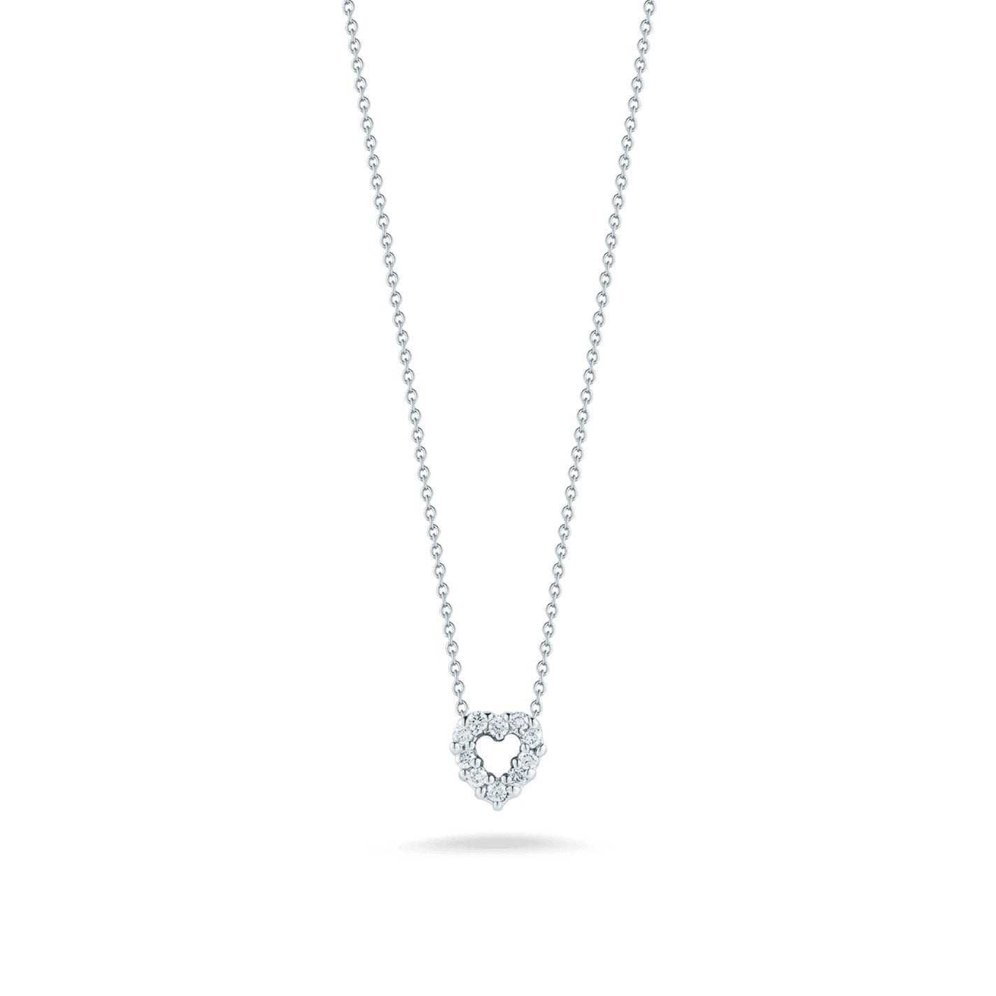 The Roberto Coin Tiny Treasures 18K White Gold Diamond Heart Necklace Pendant, crafted by the renowned brand Roberto Coin, is elegantly showcased on a simple white background.