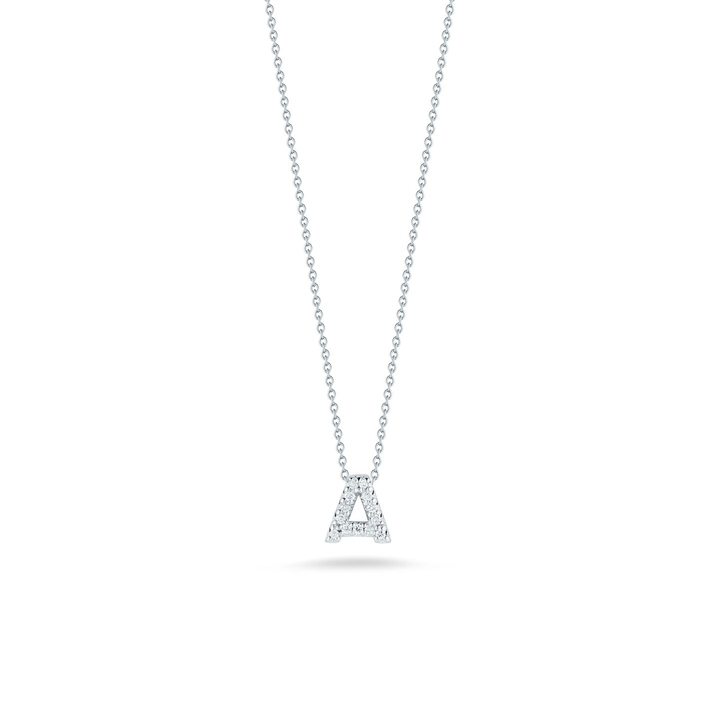 This exquisite necklace from the Roberto Coin Tiny Treasures Collection showcases a fine chain and a small, initial pendant crafted from 18 karat white gold adorned with diamonds. The pendant is elegantly displayed against a white background, emphasizing its sophisticated and minimalist design.