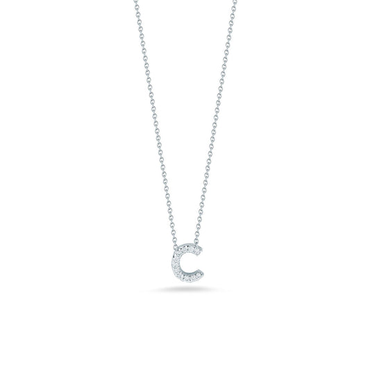 The Roberto Coin Tiny Treasures 18K White Gold Diamond Initial Necklace Pendant showcases a sparkling letter "C" adorned with round diamonds, elegantly hanging from a delicate chain against a plain white background.