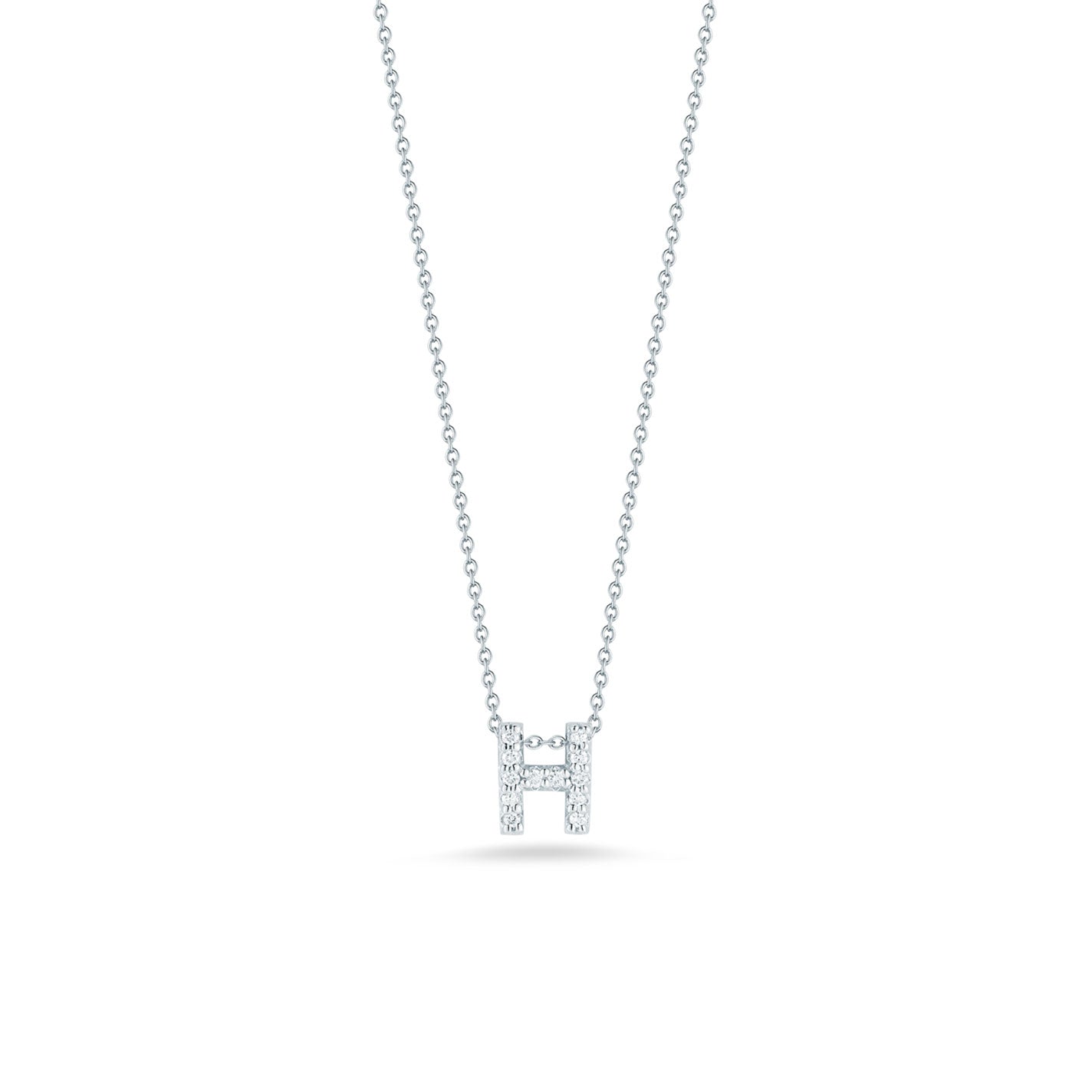 The Roberto Coin Tiny Treasures Love Letter 18K White Gold Diamond Initial Necklace Pendant features a delicate silver necklace with an 18 Karat white gold chain and a sparkling, diamond-encrusted initial "H" pendant. The white background accentuates the elegance and simplicity of this exquisite piece by Roberto Coin.