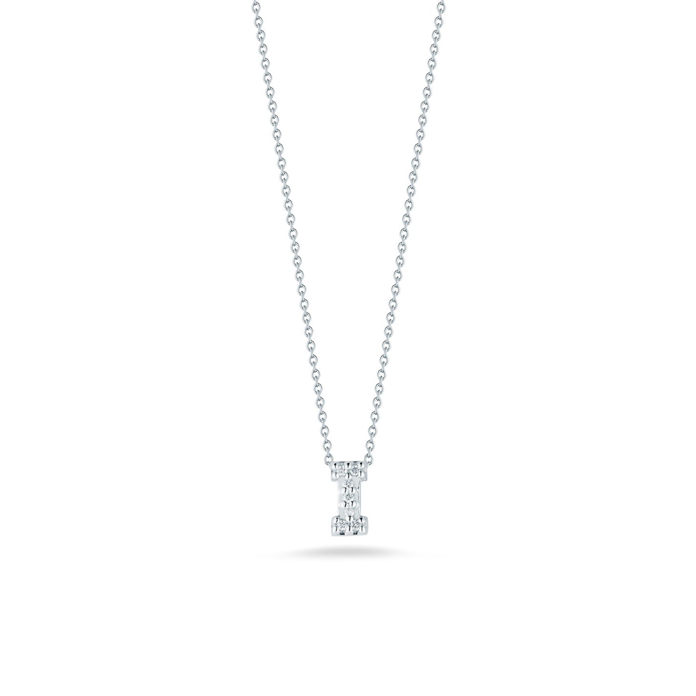 A sophisticated Roberto Coin Tiny Treasures Love Letter initial necklace pendant, crafted with an 18K white gold chain and adorned with a small diamond, is showcased on a white background. The delicate links beautifully enhance the elegantly cut diamond, adding a subtle sparkle to the minimalist design.