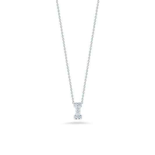 A sophisticated Roberto Coin Tiny Treasures Love Letter initial necklace pendant, crafted with an 18K white gold chain and adorned with a small diamond, is showcased on a white background. The delicate links beautifully enhance the elegantly cut diamond, adding a subtle sparkle to the minimalist design.