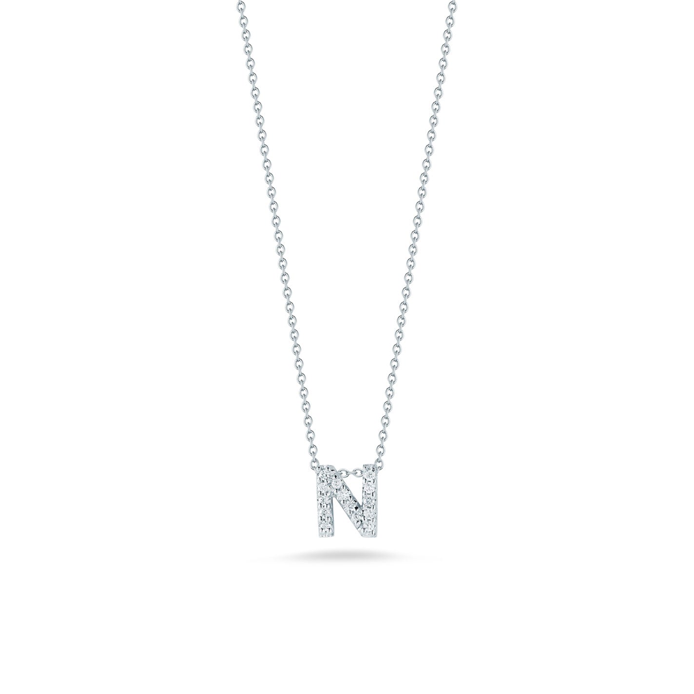 The Roberto Coin Tiny Treasures 18K White Gold Diamond Initial Necklace Pendant features a sophisticated tiny Treasures pendant shaped like the letter "N," crafted in 18 karat white gold, with a delicate chain enhancing its allure.