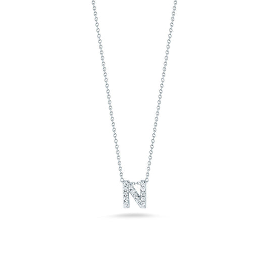 The Roberto Coin Tiny Treasures 18K White Gold Diamond Initial Necklace Pendant features a sophisticated tiny Treasures pendant shaped like the letter "N," crafted in 18 karat white gold, with a delicate chain enhancing its allure.