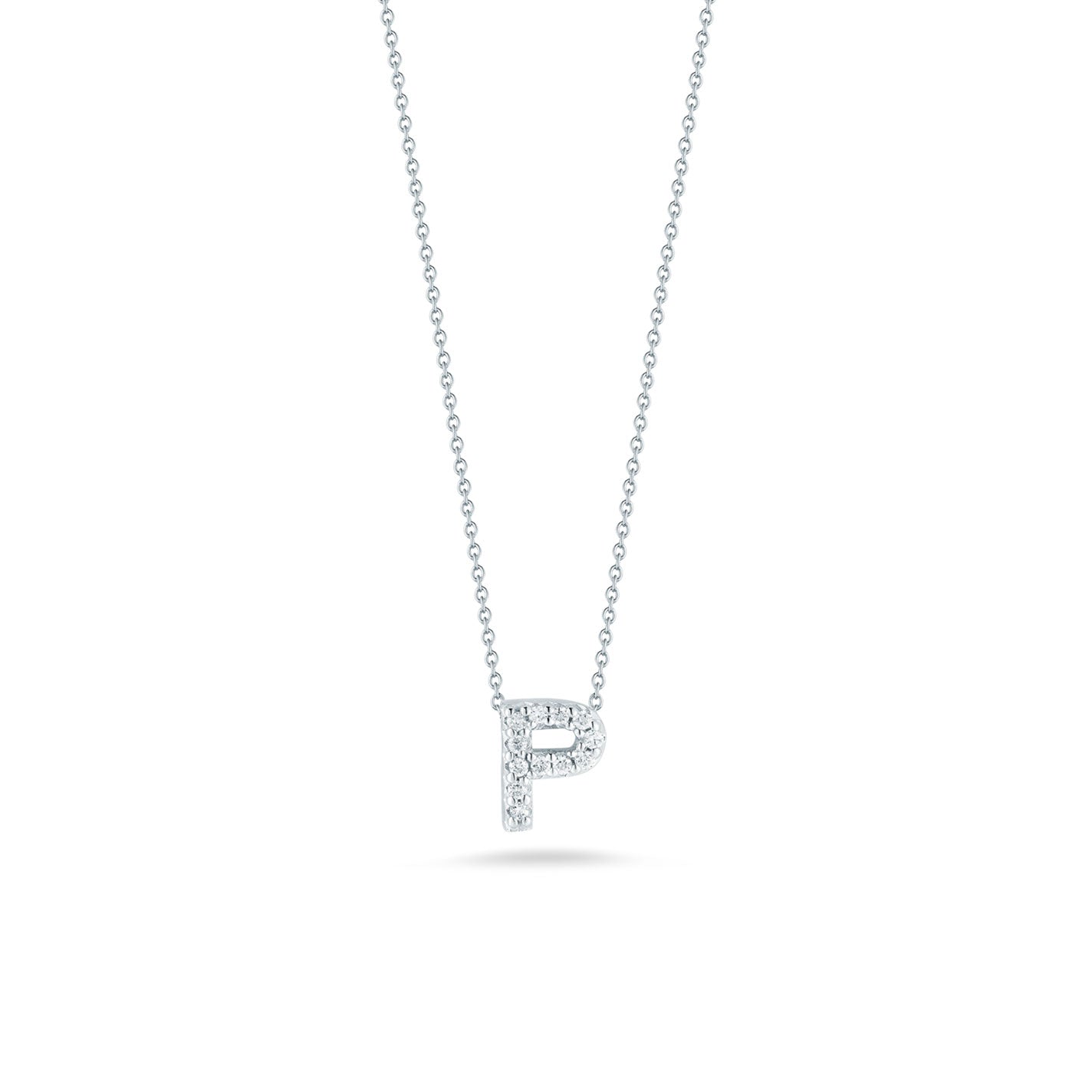 This exquisite necklace from Roberto Coin's Tiny Treasures collection showcases a pendant in the form of the letter "P," meticulously crafted from 18K white gold and embellished with dazzling diamonds. The pendant stands out beautifully against a simple white backdrop.