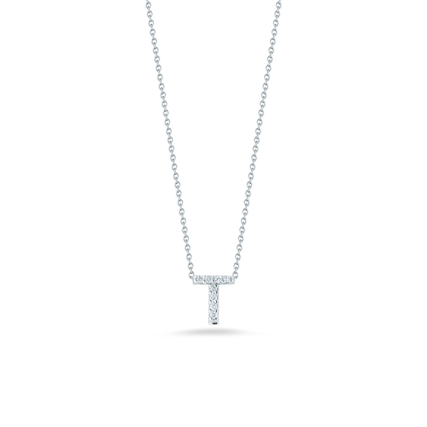 From the Roberto Coin Tiny Treasures Collection, this exquisite 18K white gold necklace features a dazzling letter "T" pendant adorned with small diamonds, elegantly highlighted against a plain white background.