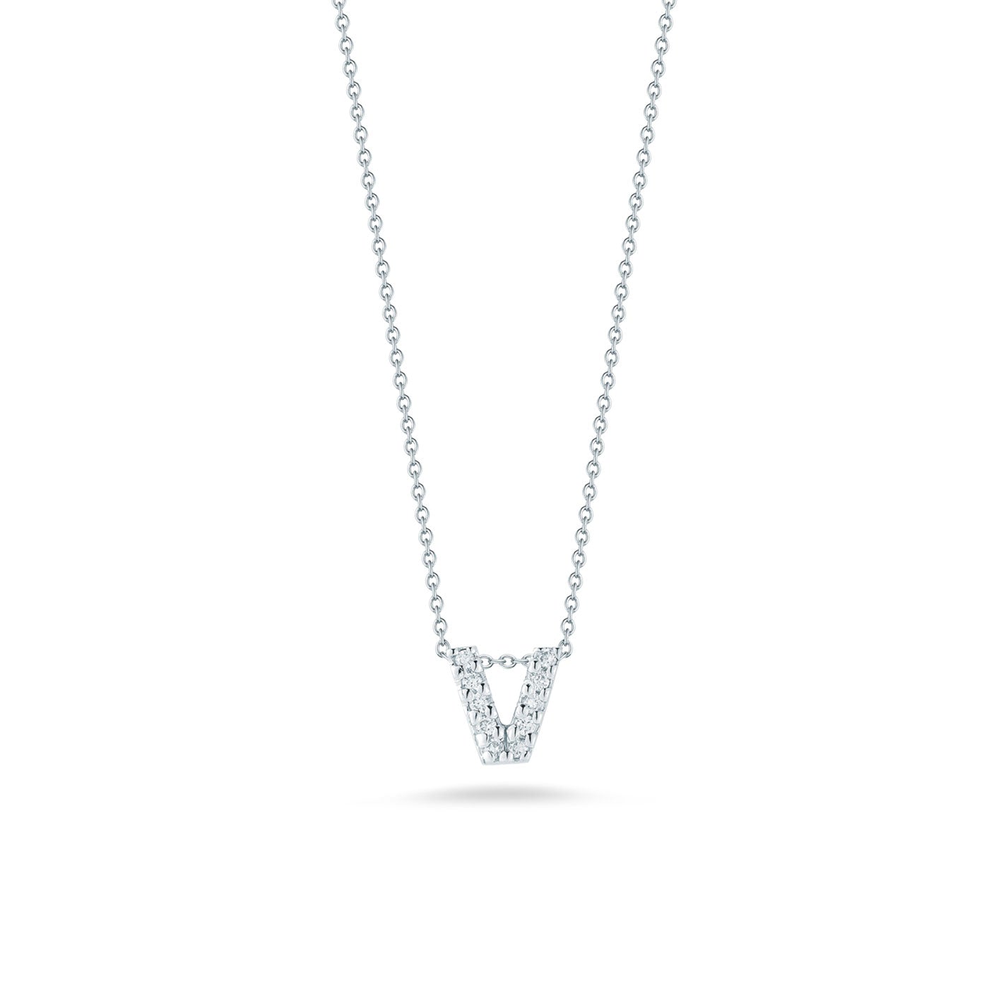 From Roberto Coin's Tiny Treasures collection, this elegant silver necklace showcases an 18K white gold pendant shaped like the letter "V". The pendant is adorned with small, sparkling diamonds, and the simple chain highlights its brilliance against a plain white background.