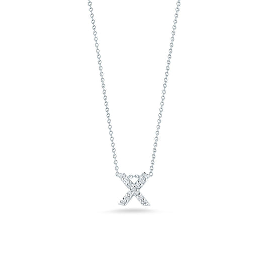 This exquisite necklace, part of Roberto Coin's Tiny Treasures collection, showcases the Love Letter 18K White Gold Diamond Initial Pendant in the shape of an "X." The pendant is adorned with sparkling diamonds and gracefully hangs from a delicate chain against a plain white background.