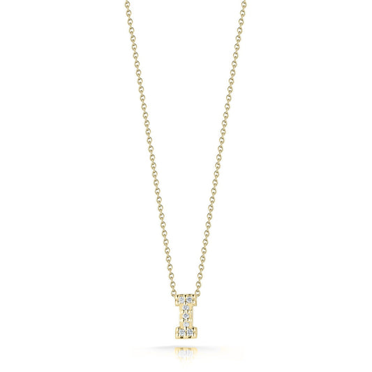 The Roberto Coin Tiny Treasures Love Letter 18K Yellow Gold Diamond Initial Necklace Pendant features a delicate chain and an intricately crafted "I" initial pendant, adorned with shimmering round diamonds. Set against a plain white background, this elegant piece by Roberto Coin is truly captivating.