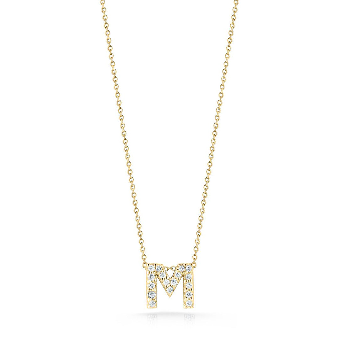 Introducing the Roberto Coin Tiny Treasures Love Letter Necklace, an exquisite 18K yellow gold piece featuring a diamond-encrusted initial "M" pendant.