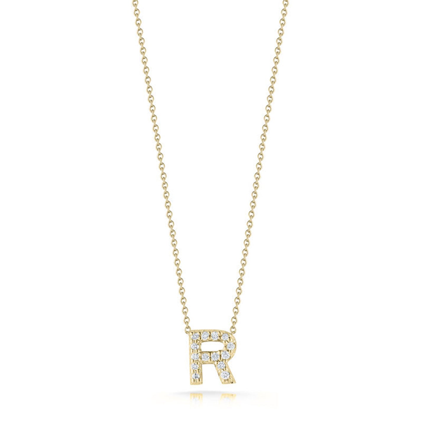 Introducing the Roberto Coin Tiny Treasures Love Letter 18K Yellow Gold Diamond Initial Necklace Pendant: a stunning piece from the renowned brand Roberto Coin. This exquisite necklace showcases a pendant in the shape of the letter "R," elegantly adorned with small diamonds. The pendant gracefully dangles from a delicate gold chain, all presented against a simple, elegant white backdrop.