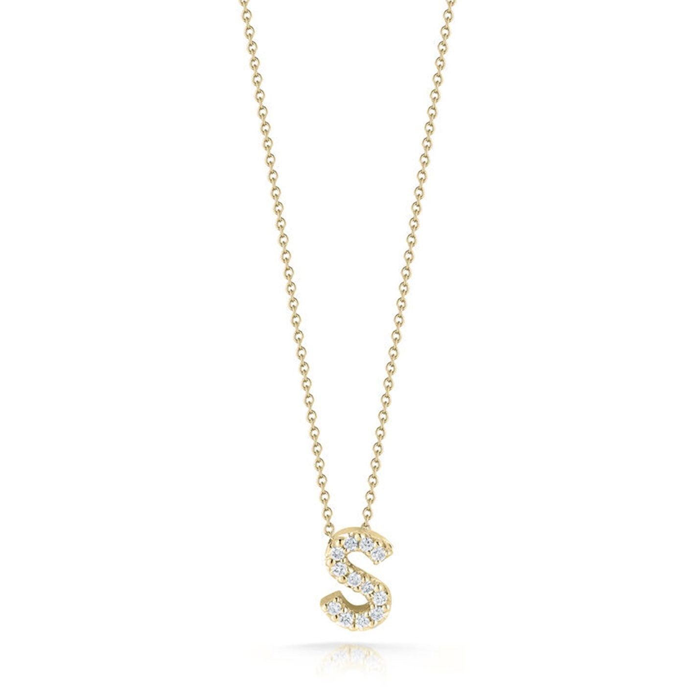 Roberto Coin's Tiny Treasures Love Letter necklace features an 18k yellow gold pendant shaped like the letter "S," adorned with small sparkling diamonds, and is elegantly suspended from a delicate chain.