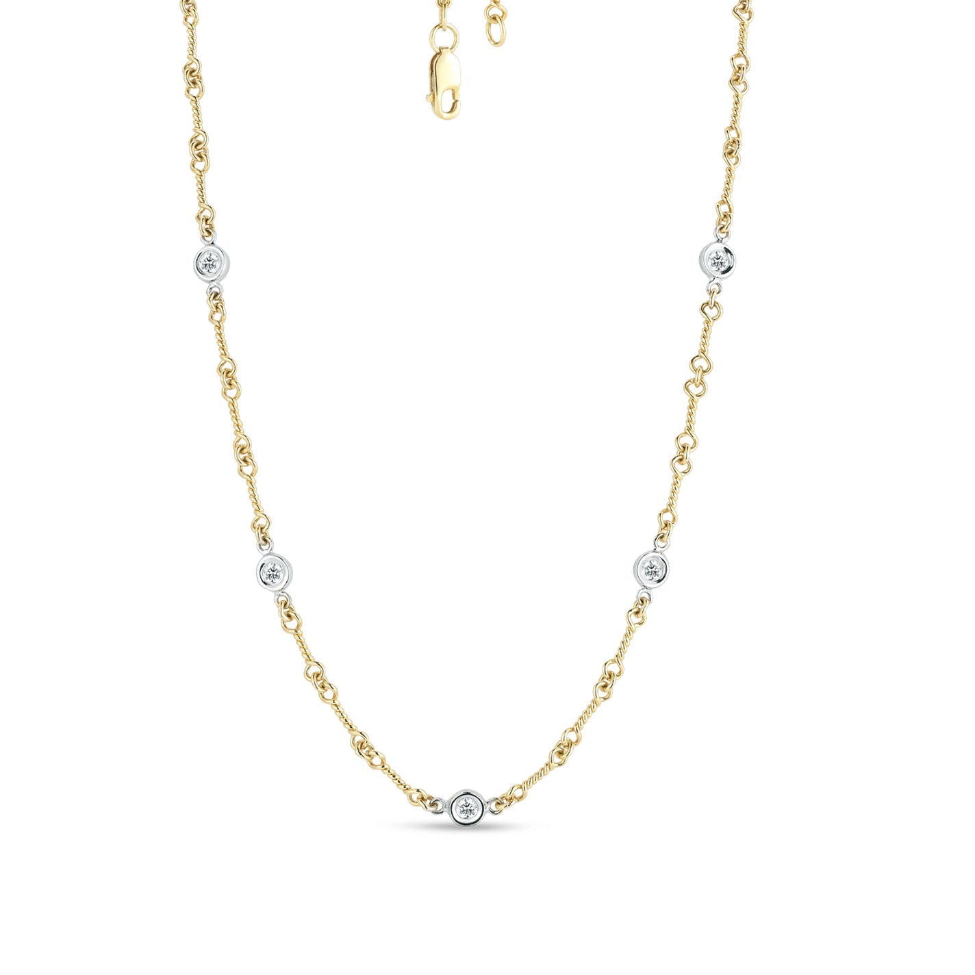 Introducing the Roberto Coin Diamonds By The Inch 18K Yellow and White Gold Station Necklace. This elegant piece, crafted by Roberto Coin, showcases small round diamond accents meticulously placed along the chain. Designed with a lobster clasp closure at the top, this necklace exudes simplicity and sophistication, making it perfect for any occasion.