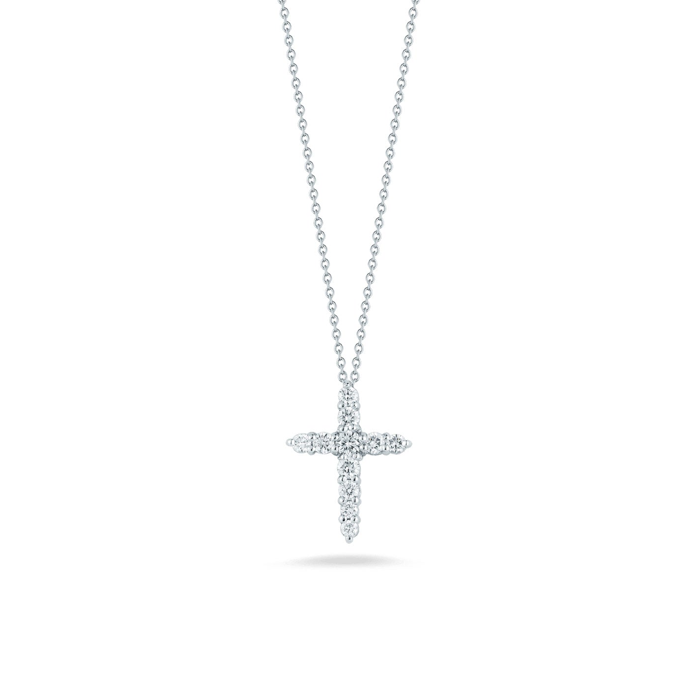 Introducing the Roberto Coin Tiny Treasures 18K White Gold Diamond Cross Necklace Pendant, an exquisite creation by Roberto Coin. This elegant necklace, crafted from 18K white gold and featuring a dazzling diamond cross pendant, is beautifully highlighted against a white background.