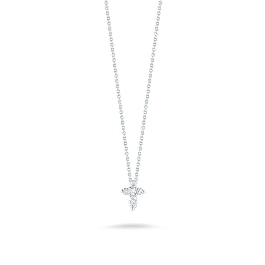 The Roberto Coin Tiny Treasures 18K White Gold Diamond Cross Necklace Pendant showcases a delicate design with its thin white gold chain and shimmering diamonds, elegantly positioned against a simple white background.