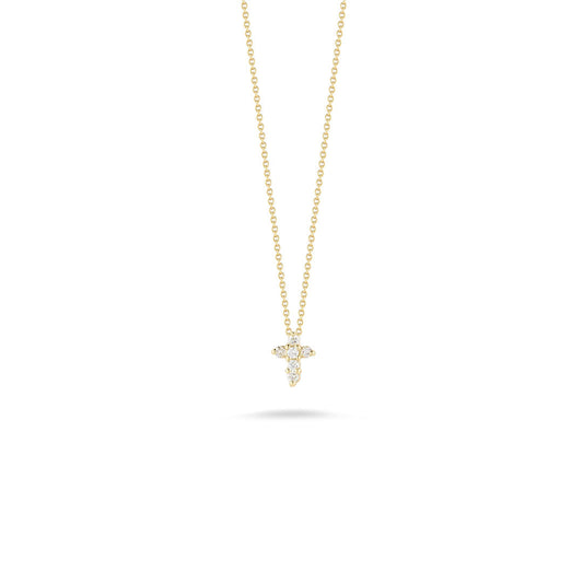 The Roberto Coin Tiny Treasures 18K Yellow Gold Diamond Baby Cross Necklace Pendant features a delicate gold chain and a small cross-shaped pendant adorned with sparkling diamonds, beautifully showcased against a plain white background.