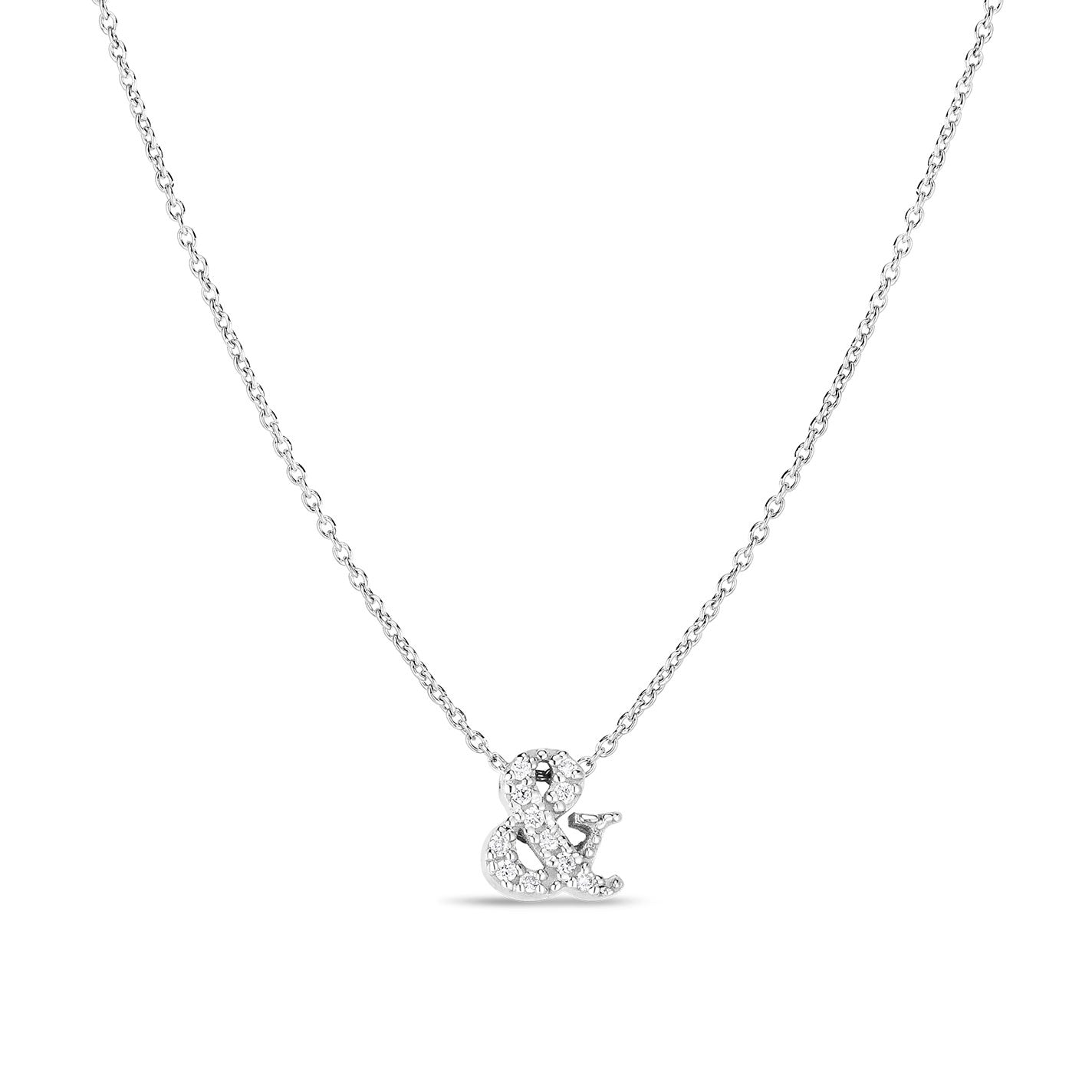 The Roberto Coin Tiny Treasures 18K White Gold Diamond Ampersand Necklace Pendant boasts an exquisite ampersand charm adorned with dazzling diamonds. Its delicate and elegant chain highlights the lustrous centerpiece beautifully.