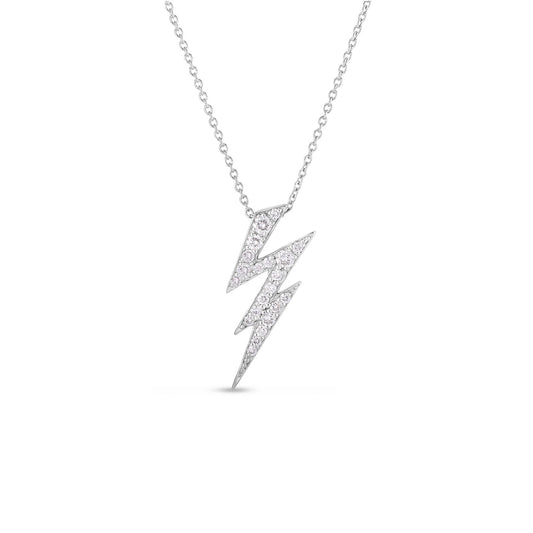 The Roberto Coin Tiny Treasures 18K White Gold Diamond Lightning Bolt Necklace Pendant features a delicate lightning bolt design adorned with shimmering diamonds on a fine chain. Crafted from 18k white gold, this piece offers a minimalistic and elegant look that stands out against a plain white background.