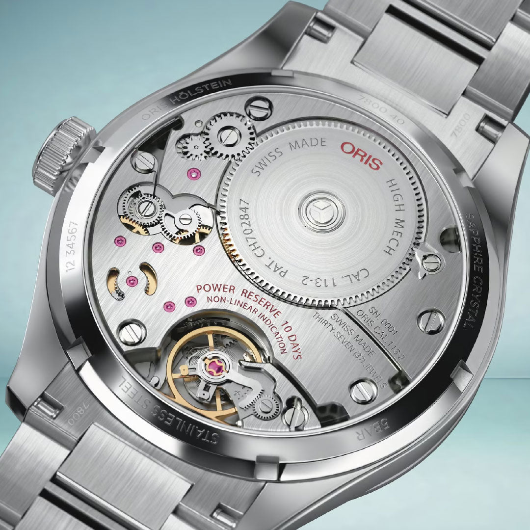 Close-up of the back of an ORIS Big Crown Calibre 113 Automatic Winding 43mm watch, showing visible gears and movement details through the stainless steel case.