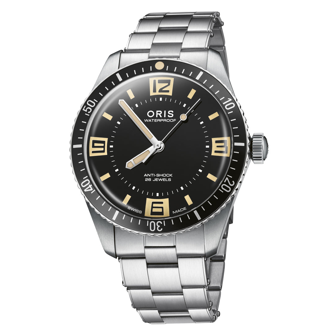 The ORIS Divers 60th Anniversary Edition Calibre 733-1 Automatic Winding 40mm features a stainless steel case, black dial with beige markers, luminous hands and numerals, rotating bezel, metal bracelet, and domed sapphire crystal.