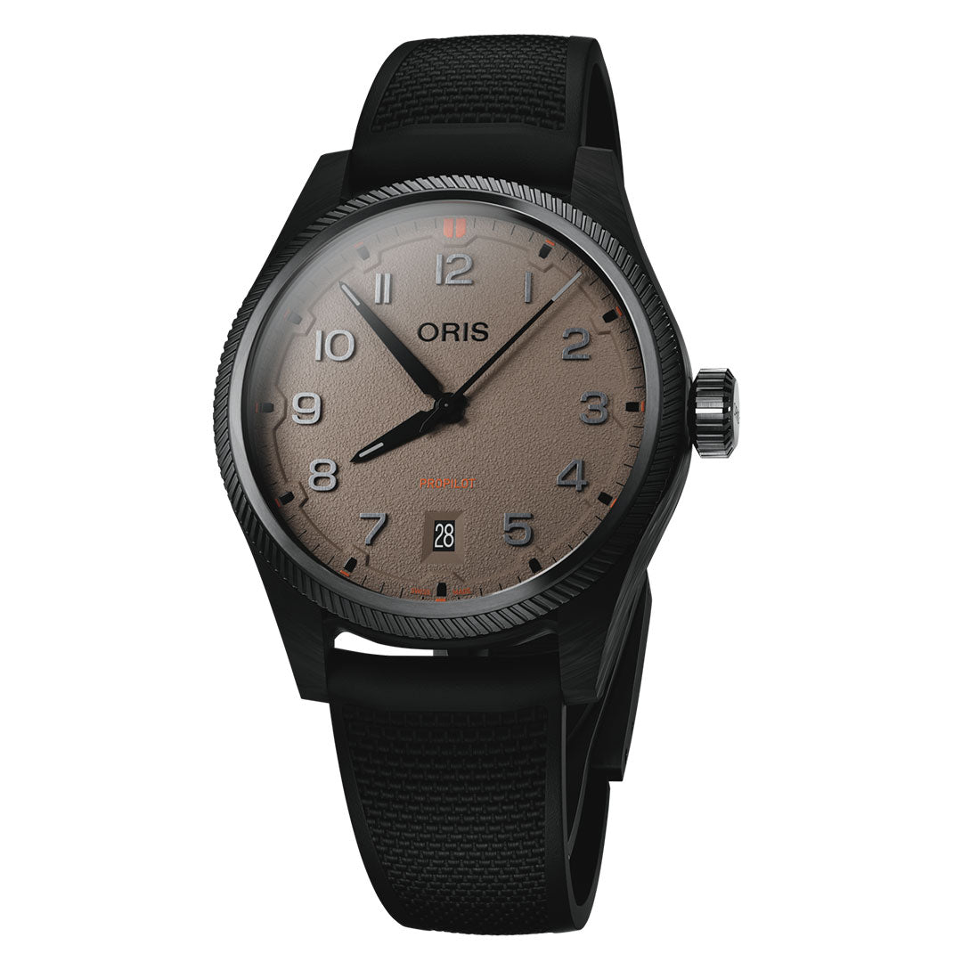 The ORIS ProPilot Desert Edition Automatic 41mm features a sandbeige dial with black numerals, a black fabric strap, date window at 6 o’clock, and a grey-PVD coated steel case with prominent crown.