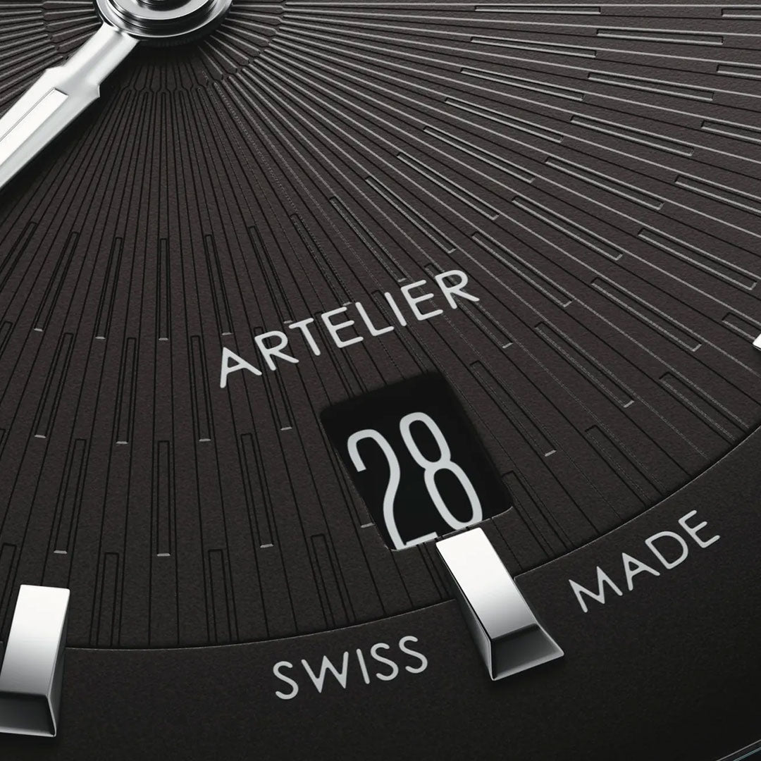 Close-up of an ORIS Artelier Date Calibre 733-1 Automatic 38mm watch face in black with silver hour markers, "ARTELIER" above the date window showing "28," and "SWISS MADE" at the bottom, showcasing this elegant Swiss automatic watch.