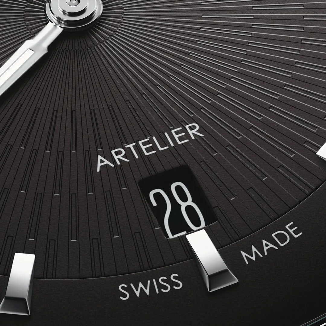 Close-up of the ORIS Artelier Date Calibre 733-1 Automatic 38mm Watch, showcasing Swiss Made quality, "ARTELIER" branding, a date display at 28, silver hour markers, refined detailing, and textured radial lines on the elegant dial.