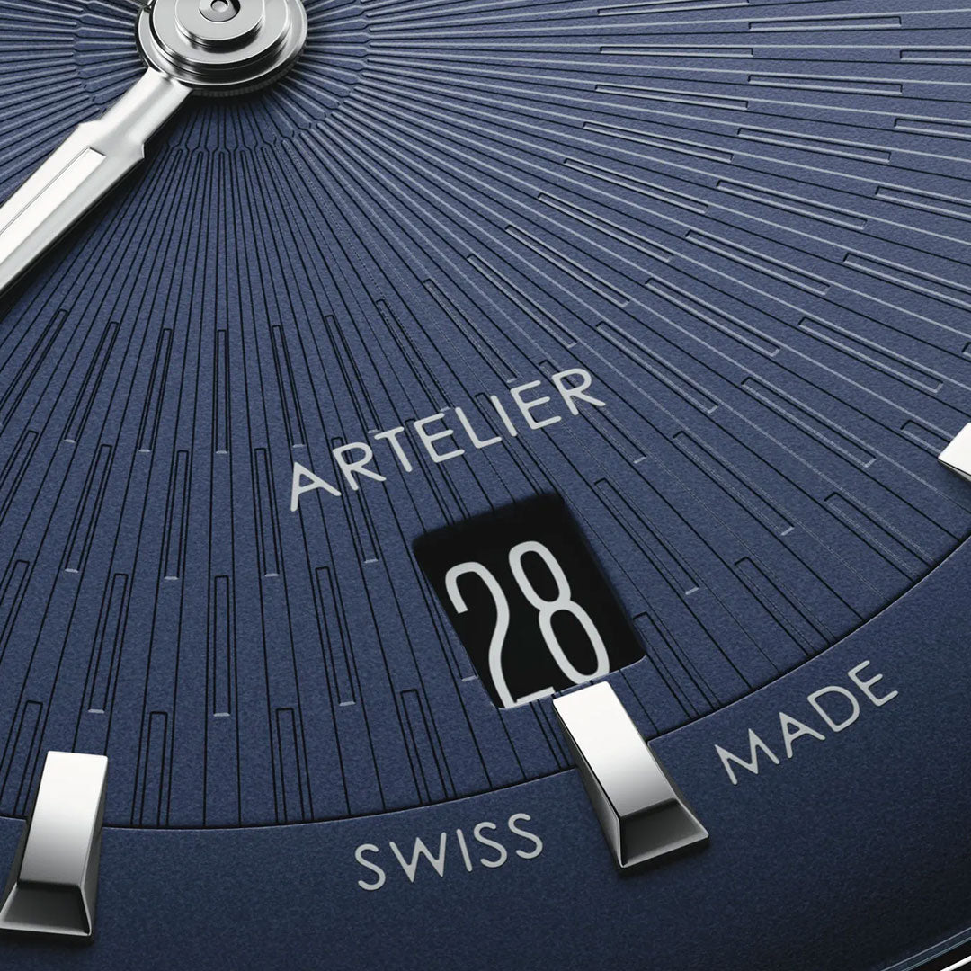 Close-up of an ORIS Artelier Date Calibre 733-1 Automatic 38mm watch face, featuring "ARTELIER," "SWISS MADE," a date window at "28," silver hour markers, and textured radial lines.