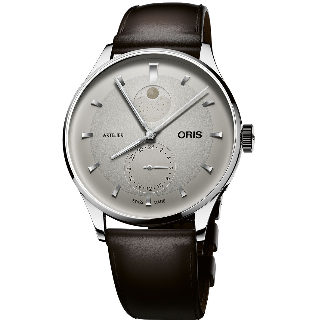 The ORIS Artelier Complication Calibre 782 Automatic 39.5mm Watch features a silver case, brown leather strap, moon phase display at 12 o'clock, 24-hour subdial, and silver hour markers and hands.