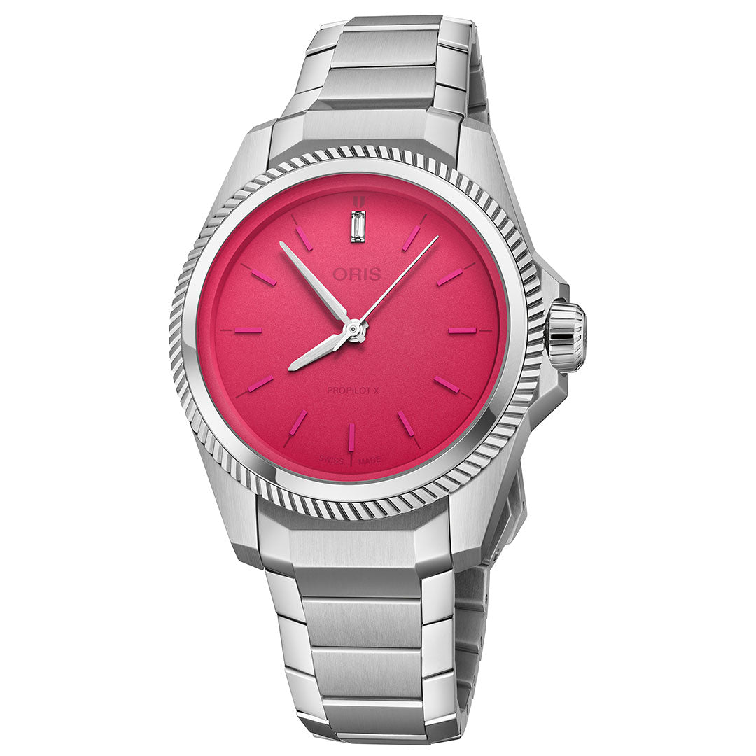 The ORIS ProPilot X Miss Piggy Edition Automatic 34mm features a stainless steel case, bright pink dial, silver markers and hands, ridged bezel, date at 6 o’clock, and metal bracelet—a stylish statement for fans of Miss Piggy.