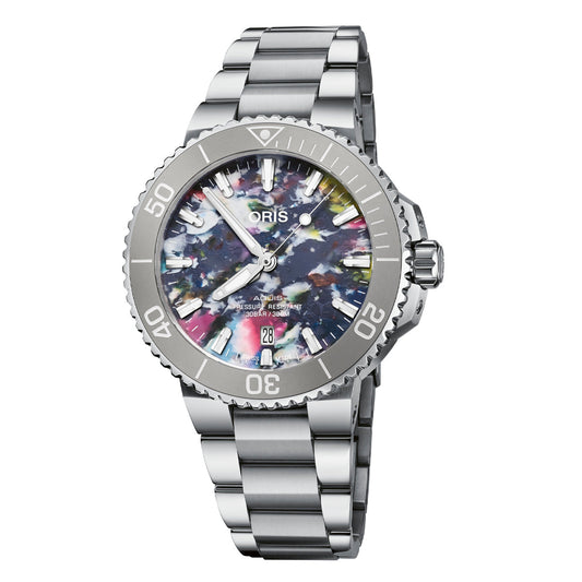 The ORIS Oris Aquis Date Automatic Winding 41.5mm Watch flaunts a stainless steel wrist design with a vibrant multi-colored dial adorned in abstract patterns. Its features include a silver bezel with minute markers, a date display positioned at 6 o'clock, and an adjustable metal link band that enhances its modern aesthetic.